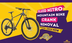 A black mountain bike on a yellow and purple background with text "FLUID NITRO MOUNTAIN BIKE CRANK REMOVAL CHECK NOW".