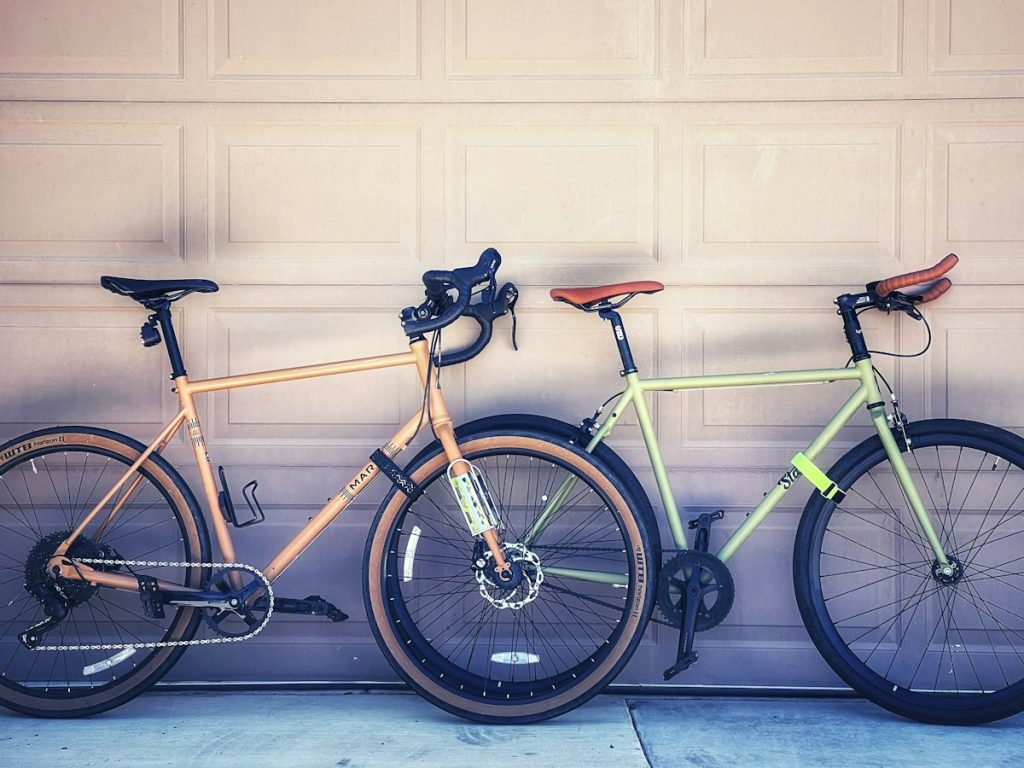 Two bicycles parked side by side for comparison