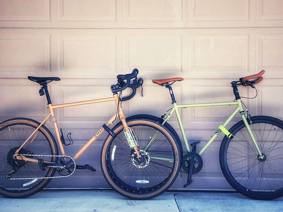 Two bicycles parked side by side